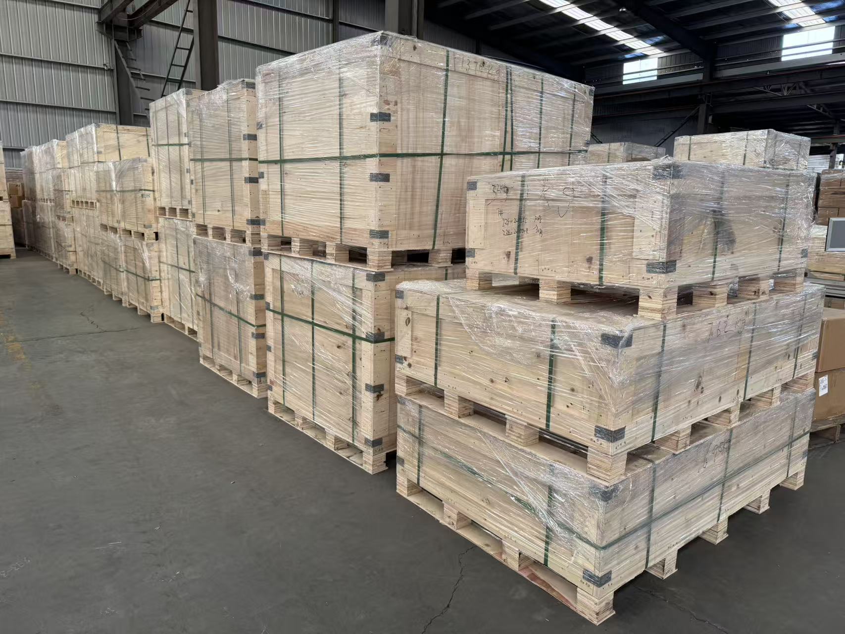 Finished VTS Spring orders secured in wrapped wooden export crates